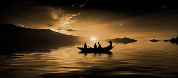 Sunset in Calm Waters With Fishermen In Boat - Sepia - Art Prints