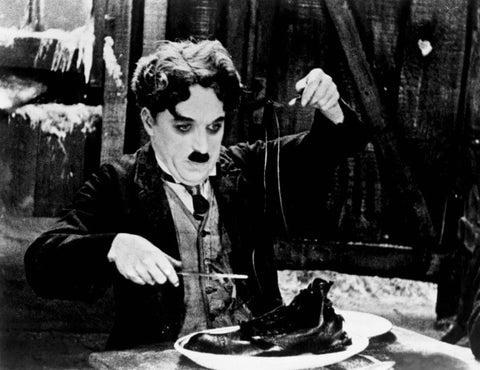 The Gold Rush - Shoe Eating Scene - Charlie Chaplin - Hollywood Classic Comedy English Movie Still Poster - Framed Prints